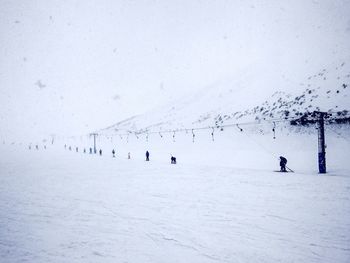 Group of people on snow covered land