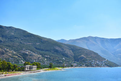 Scenic view of mountains against clear blue sky