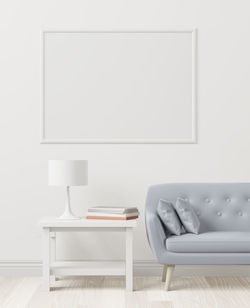 Empty chair on table against wall at home