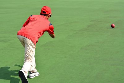 Man playing with ball on field