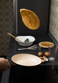 Cropped hand of woman having breakfast