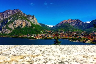 Scenic view of mountains against blue sky