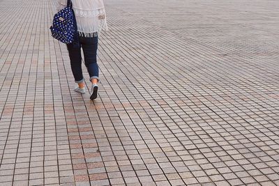 Close-up of woman walking on street