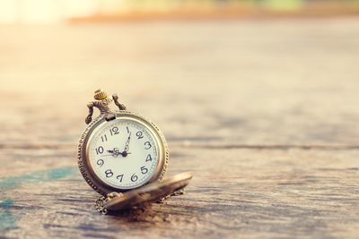 Close-up of clock on table