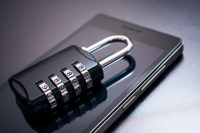 Close-up of padlock on smart phone