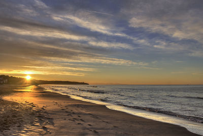 Scenic view of sea at sunset