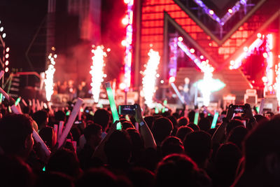 Rear view of people enjoying at music concert