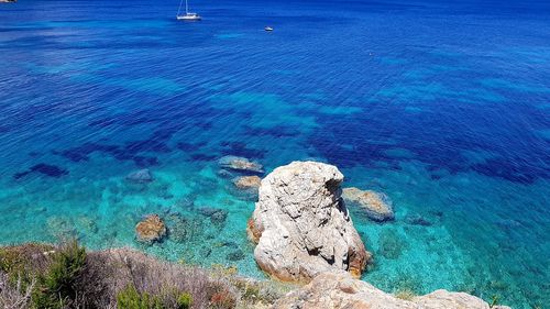 High angle view of rock in sea