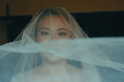 Portrait of beautiful woman wearing veil