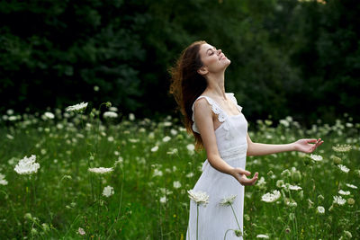 Woman standing on field