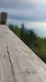 Close-up of wood against sky