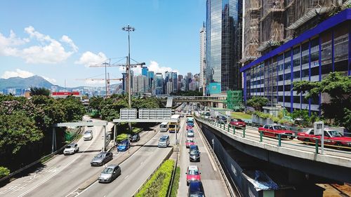 High angle view of street amidst buildings against sky