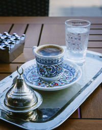 High angle view of coffee on wooden table