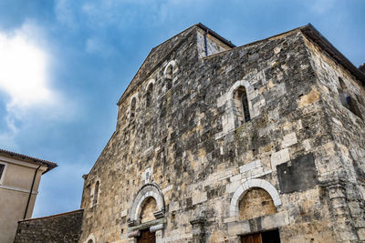 Low angle view of old building against sky