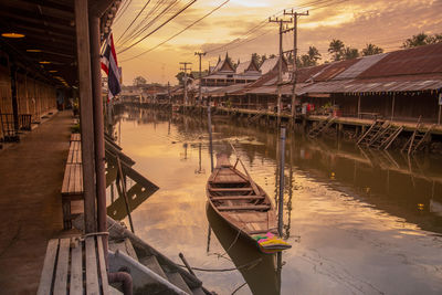 Boats moored at harbor