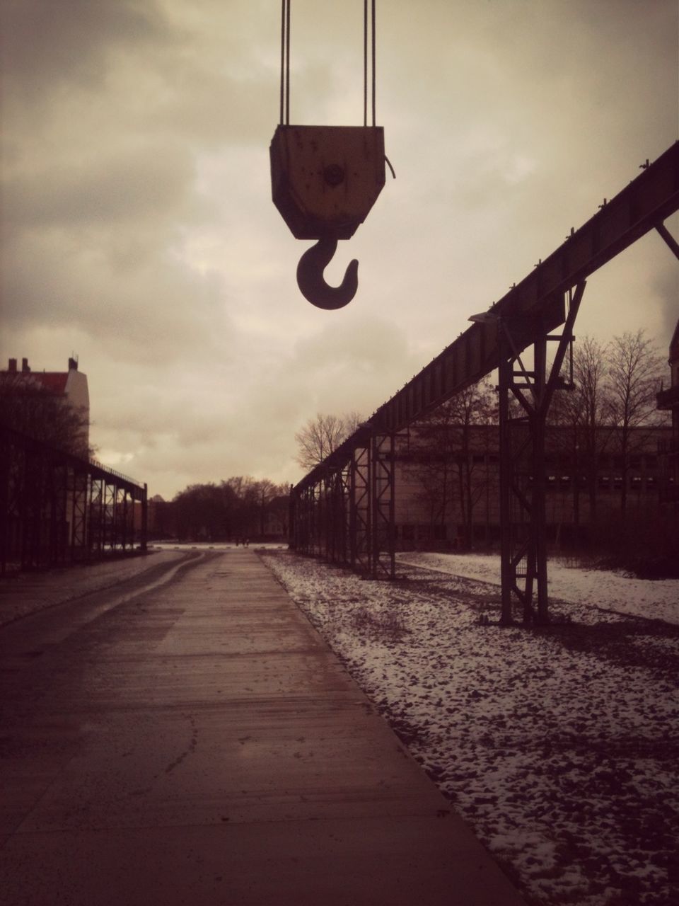 architecture, built structure, sky, the way forward, street light, building exterior, lighting equipment, transportation, connection, cloud - sky, diminishing perspective, empty, metal, outdoors, no people, pole, cloud, day, railing, bridge - man made structure