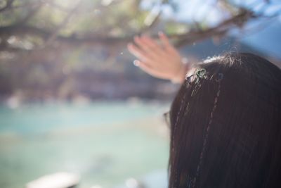 Close-up of woman hand against blurred background