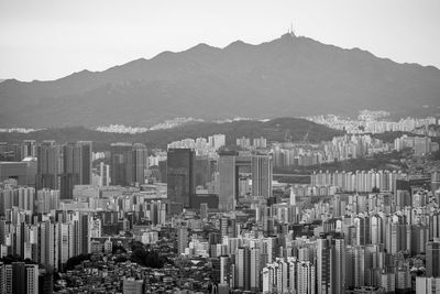 Aerial view of cityscape against sky