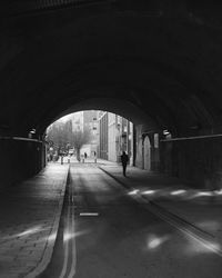 People walking in tunnel