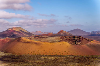 Scenic view of volcano crater desert against sky