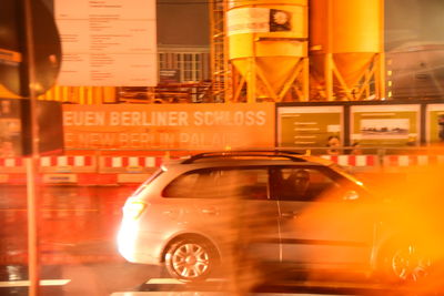 Close-up of illuminated car on city at night