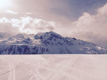 Scenic view of snowcapped mountains against sky