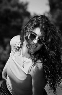 Portrait of young woman wearing sunglasses