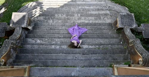 Girl lying down on steps