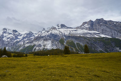 Scenic view of snowcapped mountains against sky