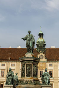 Low angle view of statue against sky