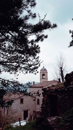 Low angle view of bell tower against sky