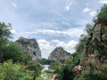 Panoramic view of rocks and trees against sky