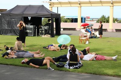 Group of people sitting at park