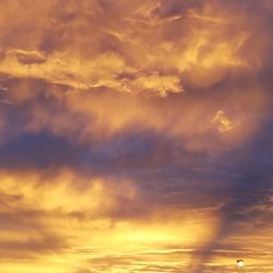 Scenic view of dramatic sky during sunset