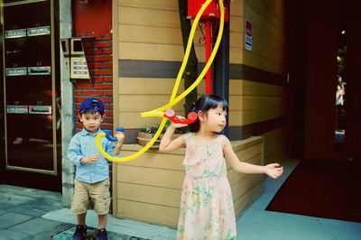 Children playing with toy phone