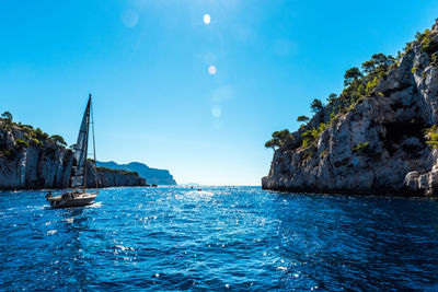 Scenic view of sea against blue sky