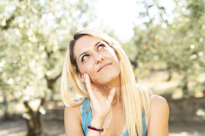 Portrait of young woman standing outdoors