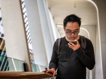 Young man using mobile phone