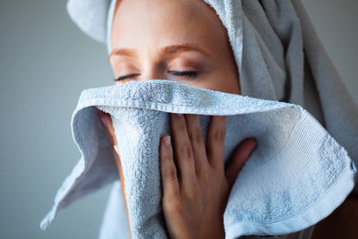 Close-up portrait of mid adult man holding camera