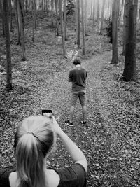 Rear view of women in forest