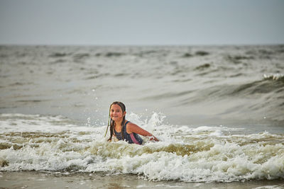 Portrait of young woman in sea