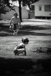 Boy playing in yard