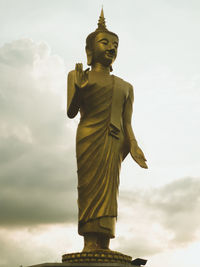 Low angle view of statue against sky