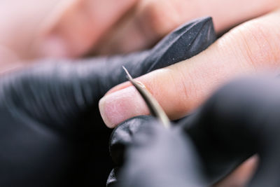 Close-up of woman holding hand