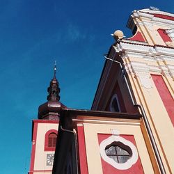 Low angle view of church against blue sky