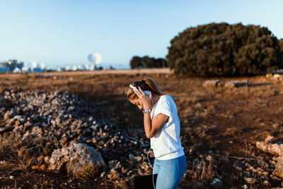 Man photographing on field