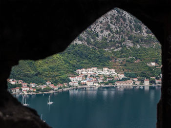 Scenic view of lake by buildings in town