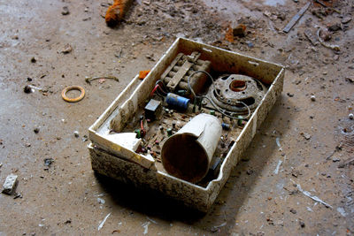 High angle view of disposable glass in box on street