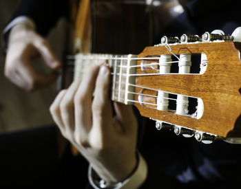 Close-up of playing guitar