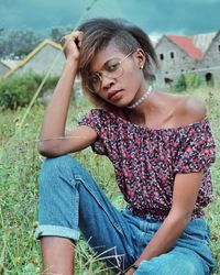 Portrait of young woman sitting outdoors